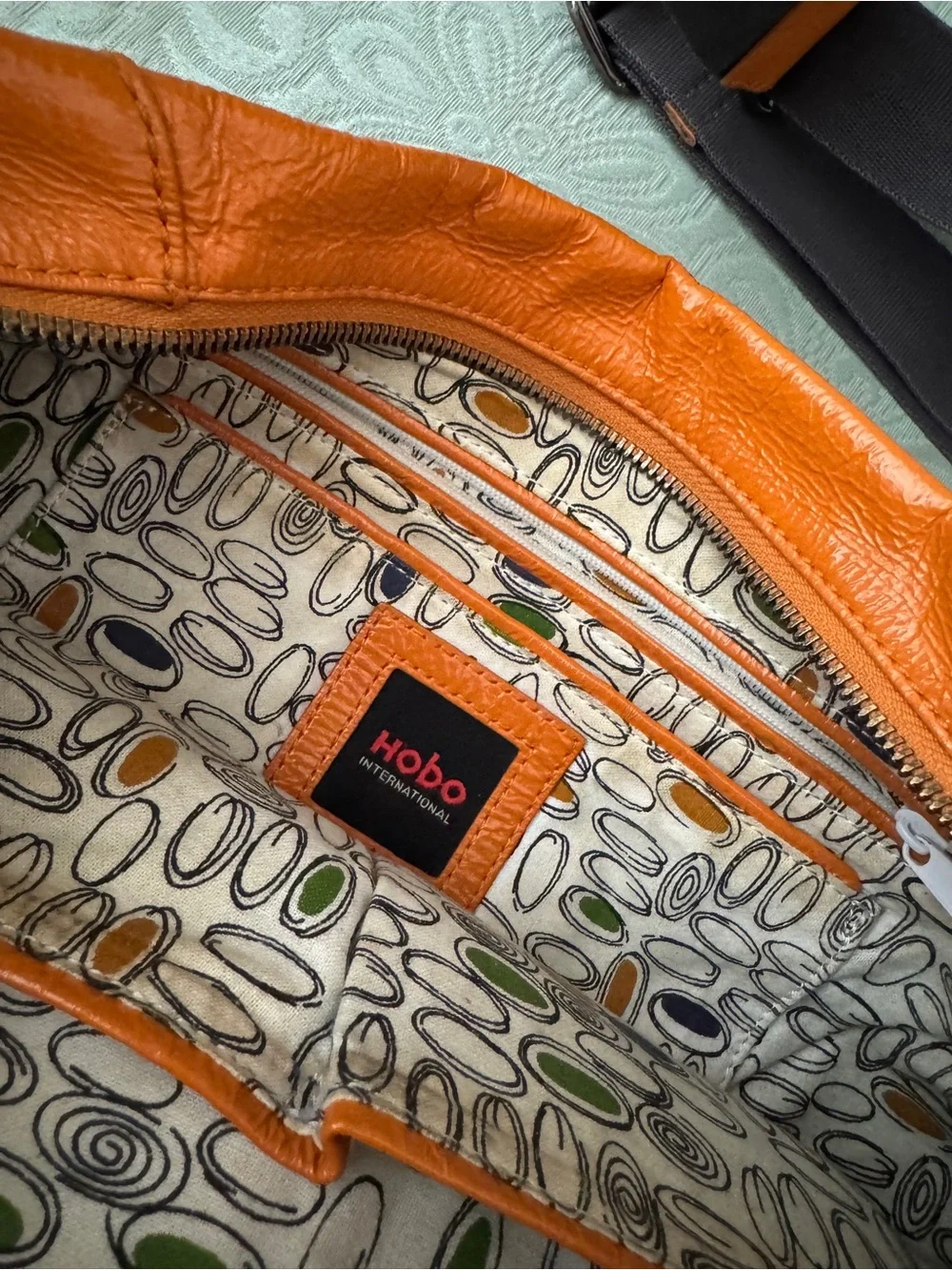 Bright orange HOBO bag